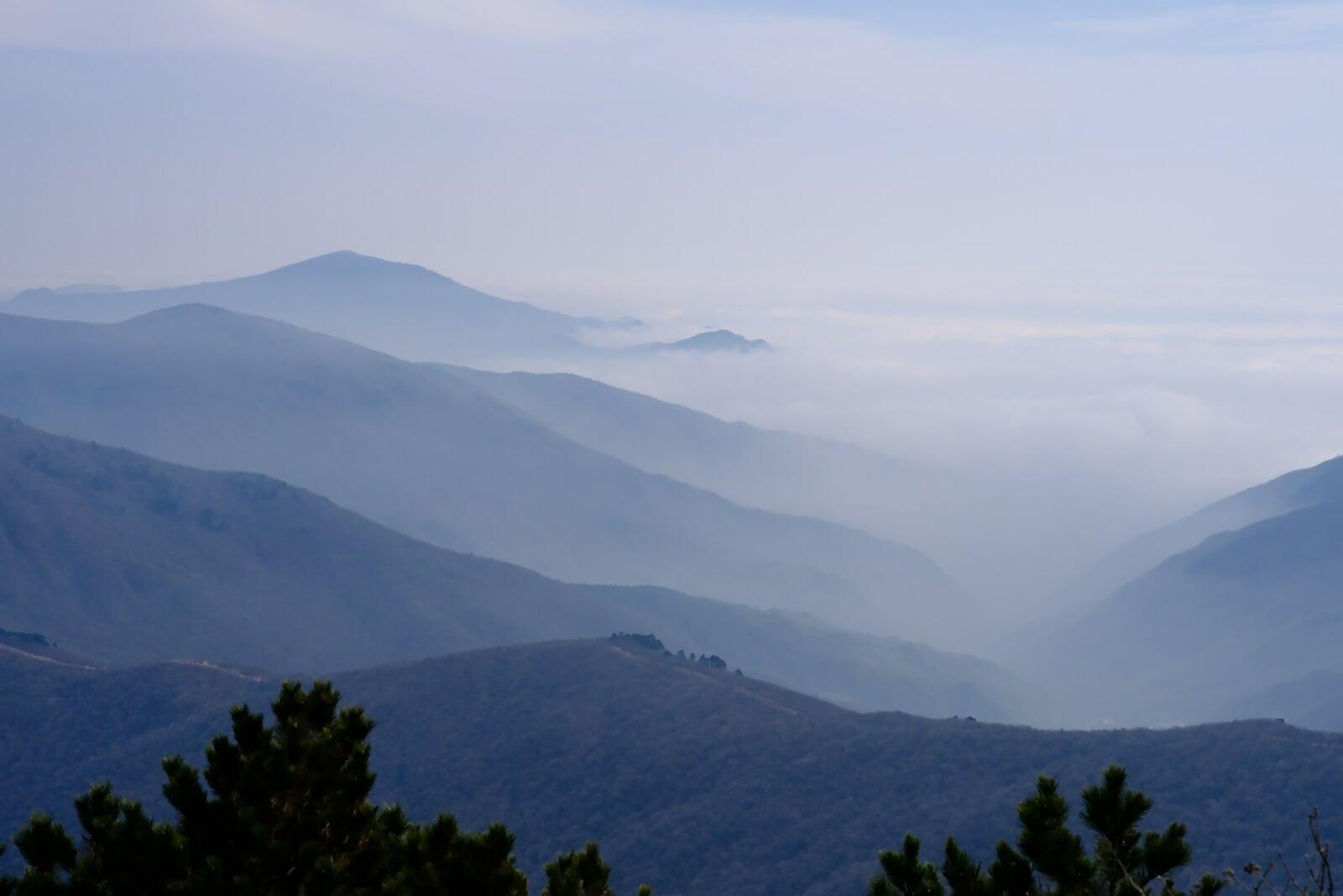 Mountains obscured by low clouds